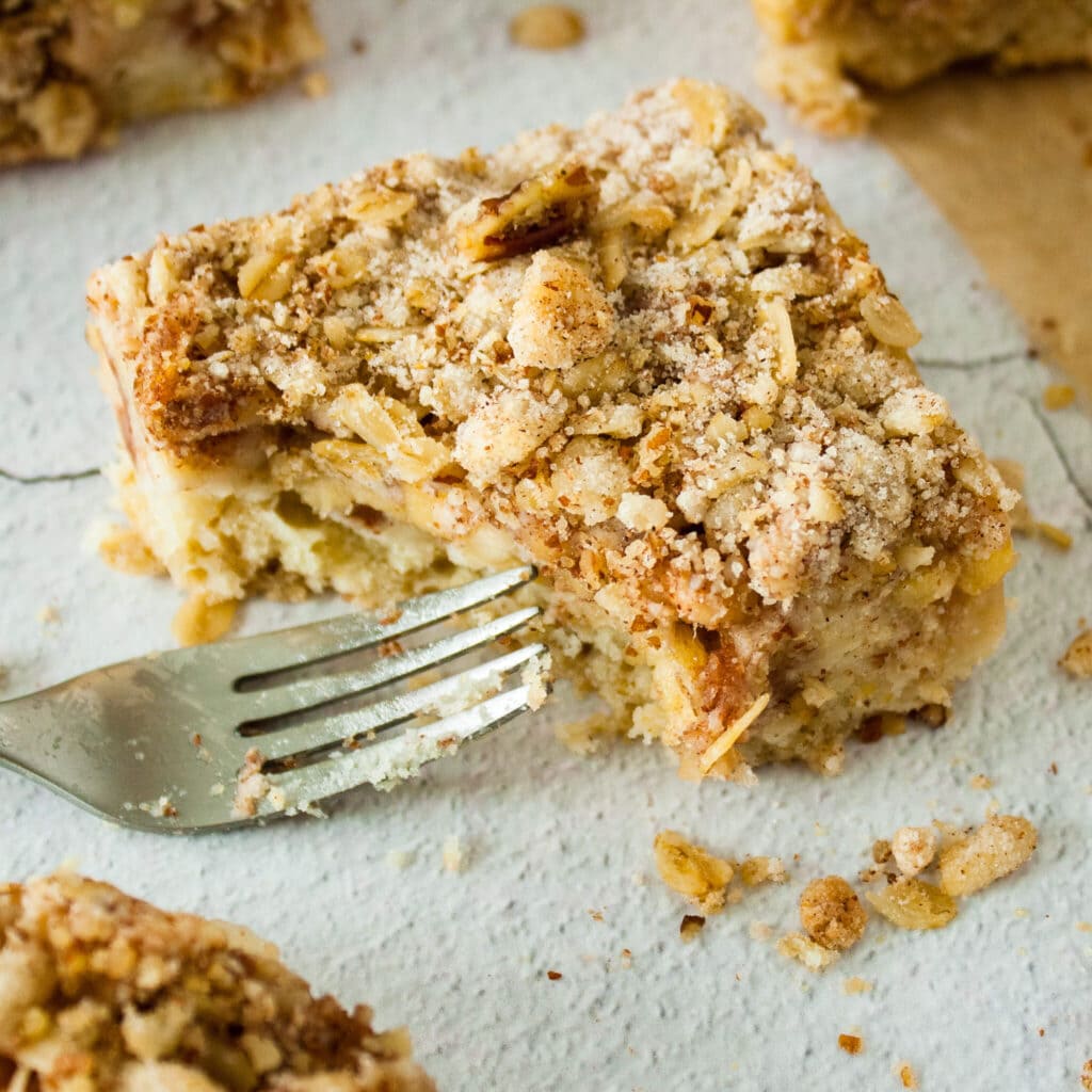 Photo of an apple crisp bar with a fork