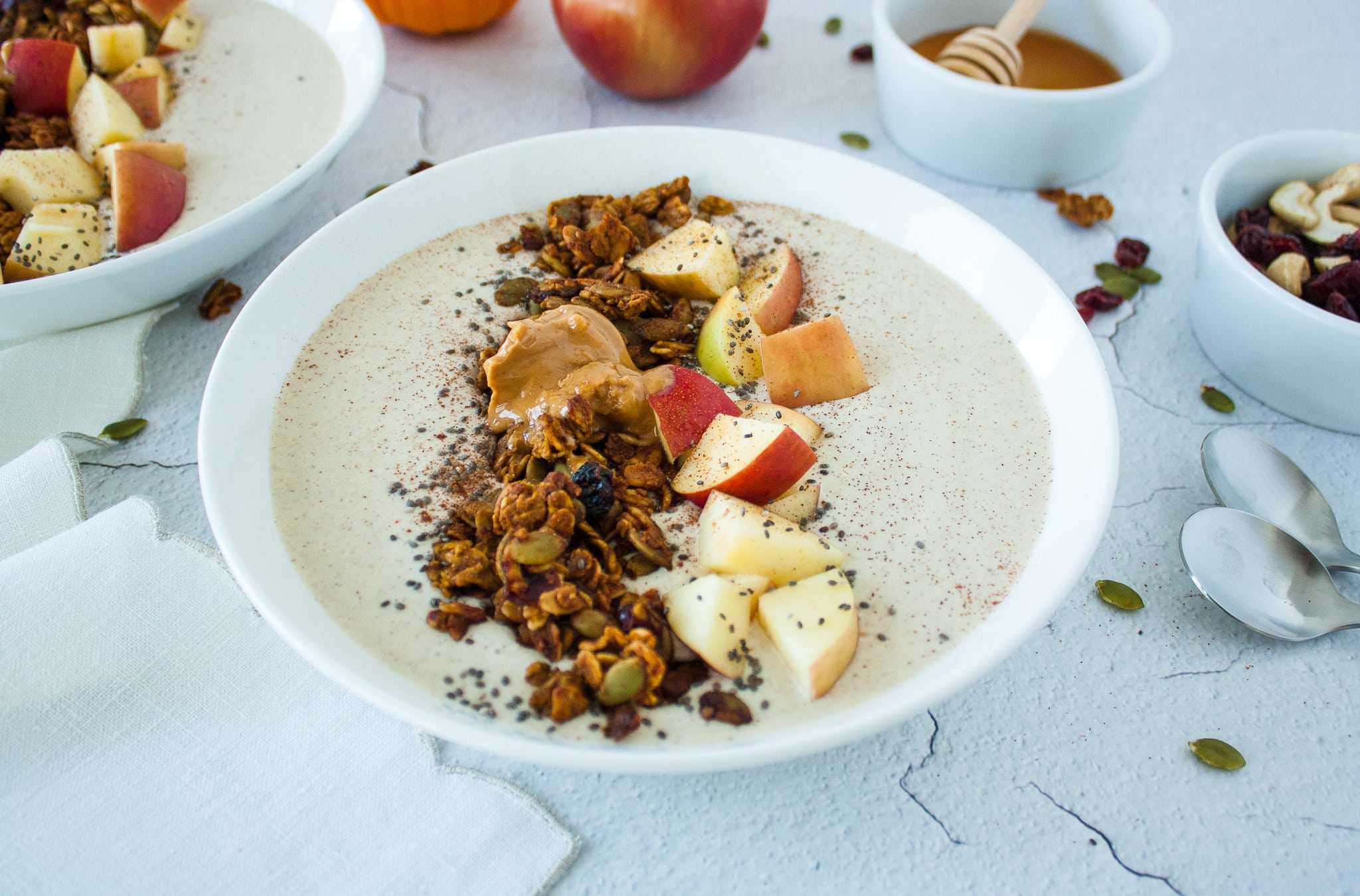 Cinnamon Apple Smoothie Bowl Topped with Pumpkin Seed Granola and Chopped Apples