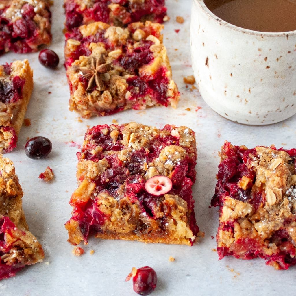 Picture of oatmeal cranberry bars with mug of coffee